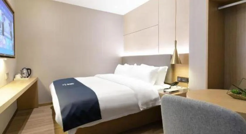 Bed in Echarm Hotel Guangzhou Gangding Huashi Metro Station