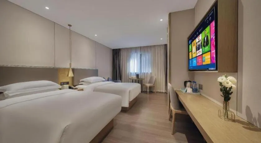 Bed in Echarm Hotel Guangzhou Gangding Huashi Metro Station