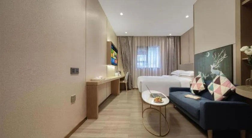 Bed in Echarm Hotel Guangzhou Gangding Huashi Metro Station