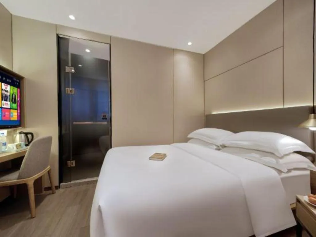 Bed in Echarm Hotel Guangzhou Gangding Huashi Metro Station