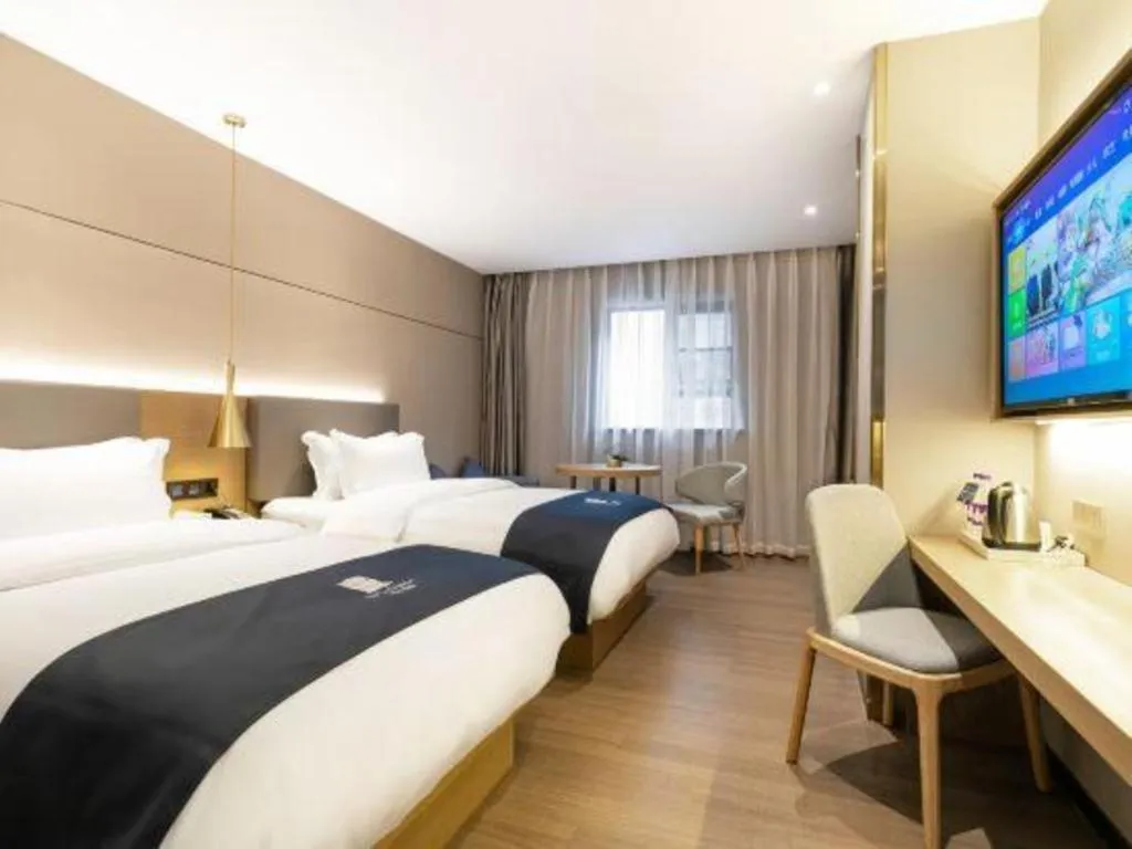 Bed in Echarm Hotel Guangzhou Gangding Huashi Metro Station