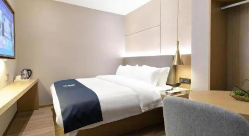 Bed in Echarm Hotel Guangzhou Gangding Huashi Metro Station