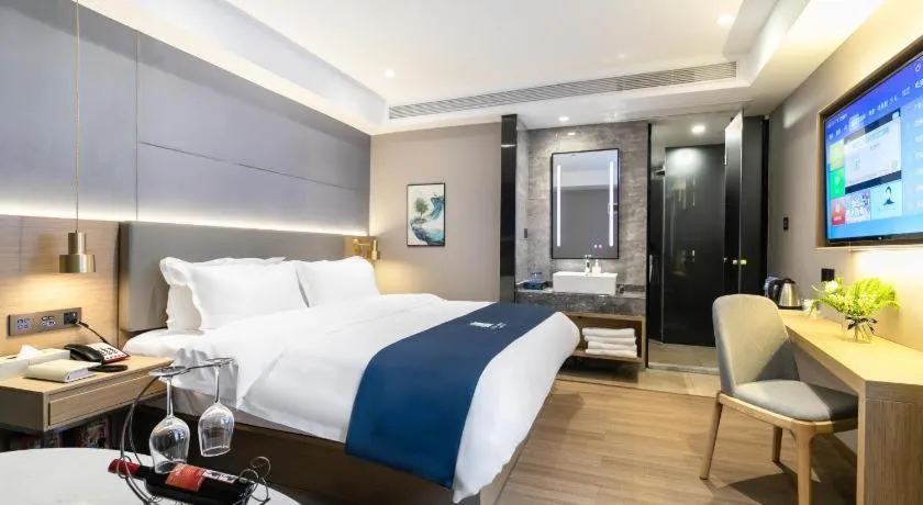 Bed in Echarm Hotel Guangzhou Gangding Huashi Metro Station