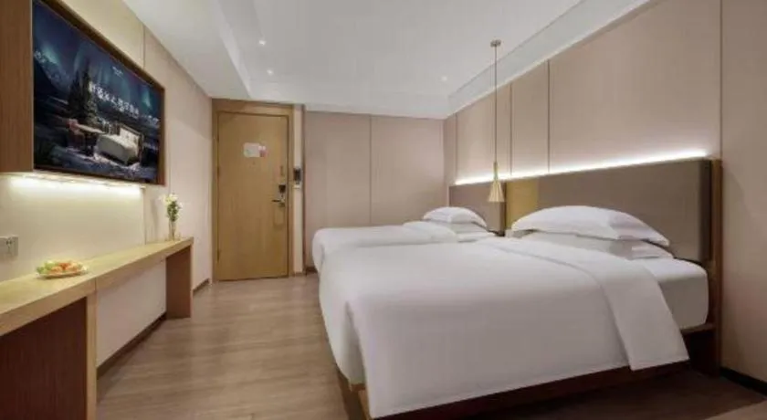 Bed in Echarm Hotel Guangzhou Gangding Huashi Metro Station