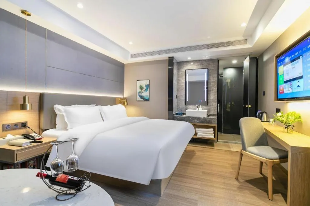 Bed in Echarm Hotel Guangzhou Gangding Huashi Metro Station