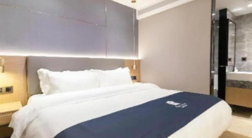 Bed in Echarm Hotel Guangzhou Gangding Huashi Metro Station