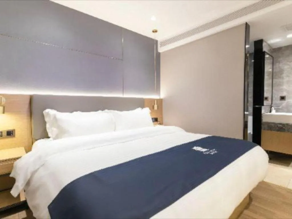 Bed in Echarm Hotel Guangzhou Gangding Huashi Metro Station