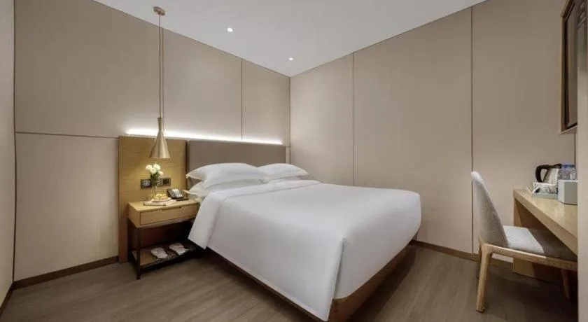 Bed in Echarm Hotel Guangzhou Gangding Huashi Metro Station