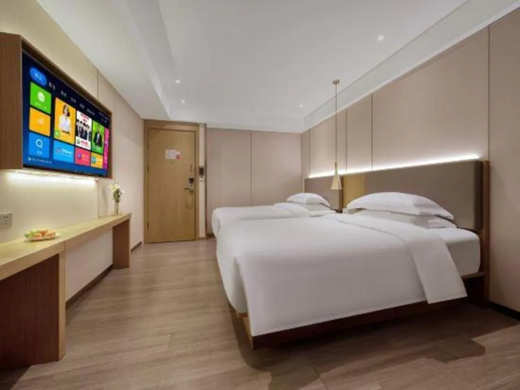 Bed in Echarm Hotel Guangzhou Gangding Huashi Metro Station