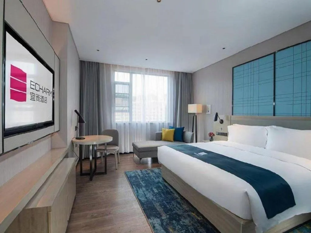 Bed in Echarm Hotel Shenzhen International Exhibition Center Fuyong