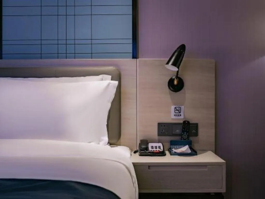 Bed in Echarm Hotel Shenzhen International Exhibition Center Fuyong