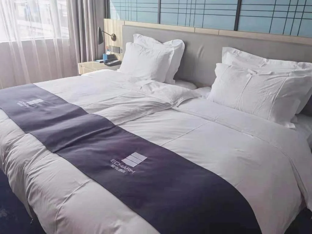 Bed in Echarm Hotel Shenzhen International Exhibition Center Fuyong