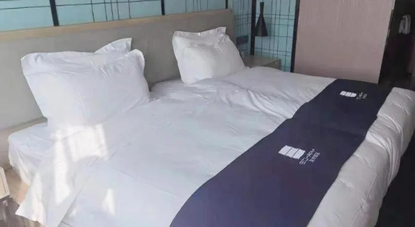 Bed in Echarm Hotel Shenzhen International Exhibition Center Fuyong