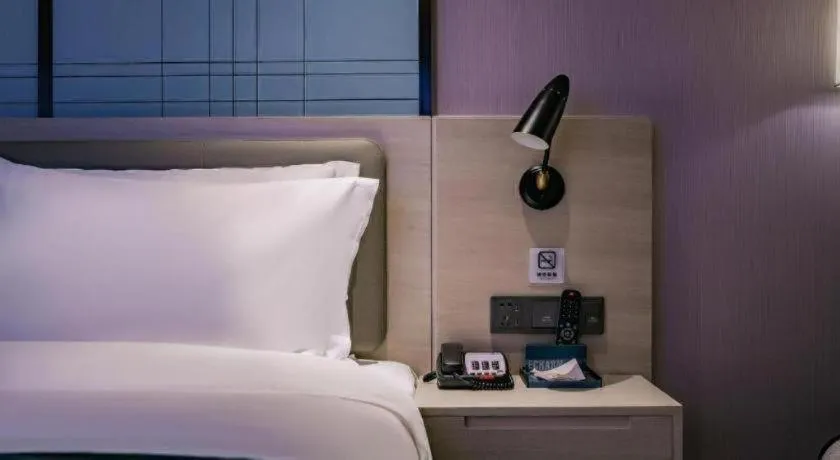 Bed in Echarm Hotel Shenzhen International Exhibition Center Fuyong