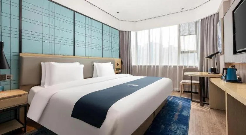 Bed in Echarm Hotel Shenzhen International Exhibition Center Fuyong