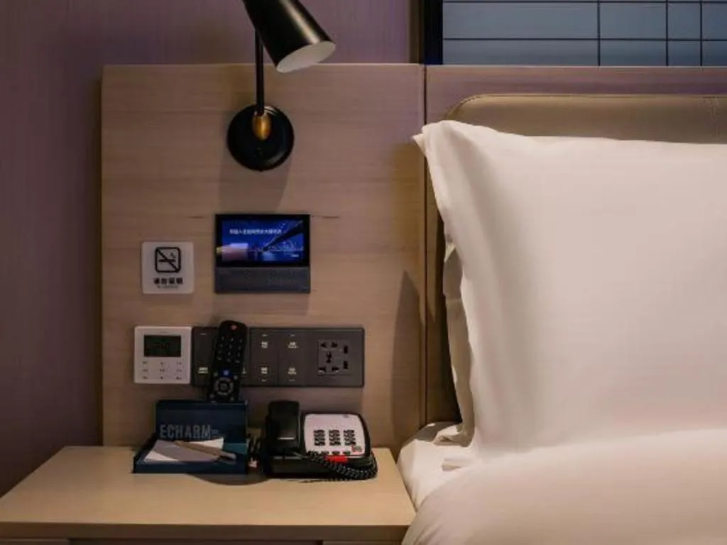 Bed in Echarm Hotel Shenzhen International Exhibition Center Fuyong