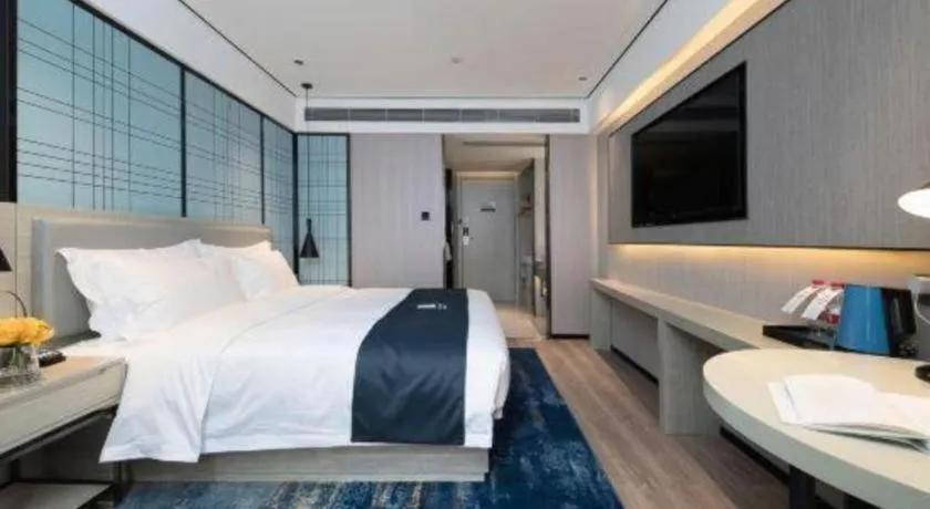 Bed in Echarm Hotel Shenzhen International Exhibition Center Fuyong