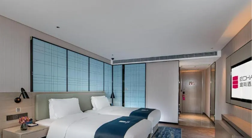 Bed in Echarm Hotel Shenzhen International Exhibition Center Fuyong