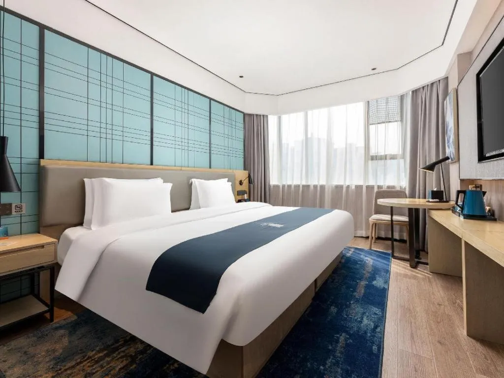 Bed in Echarm Hotel Shenzhen International Exhibition Center Fuyong