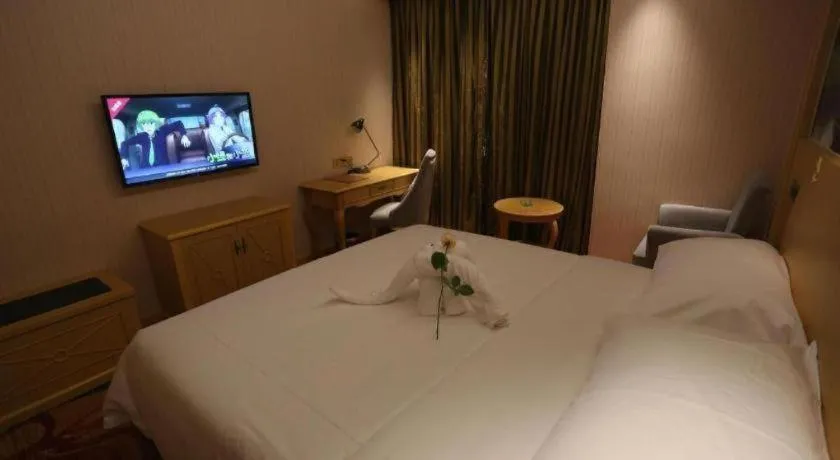 Bed in Vienna Hotel Hangzhou Jiubao Sijiqing Suanli Town