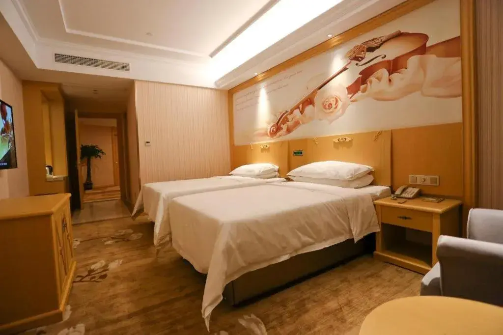 Bed in Vienna Hotel Hangzhou Jiubao Sijiqing Suanli Town Bed in Vienna Hotel Hangzhou Jiubao Sijiqing Suanli Town