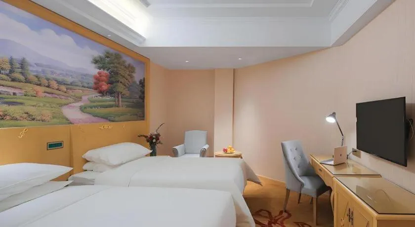 Bed in Vienna Hotel Hangzhou Jiubao Sijiqing Suanli Town