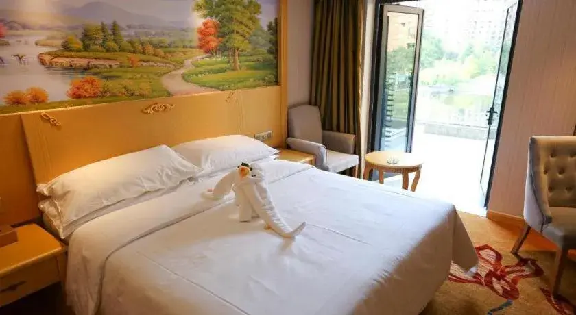 Bed in Vienna Hotel Hangzhou Jiubao Sijiqing Suanli Town Bed in Vienna Hotel Hangzhou Jiubao Sijiqing Suanli Town