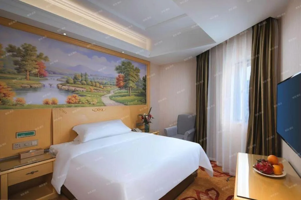 Bed in Vienna Hotel Hangzhou Jiubao Sijiqing Suanli Town