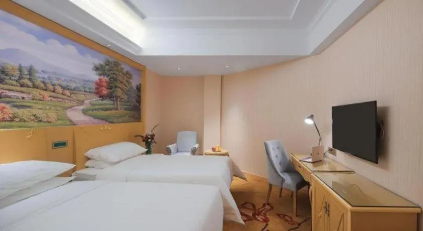 Bed in Vienna Hotel Hangzhou Jiubao Sijiqing Suanli Town