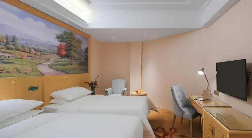 Bed in Vienna Hotel Hangzhou Jiubao Sijiqing Suanli Town