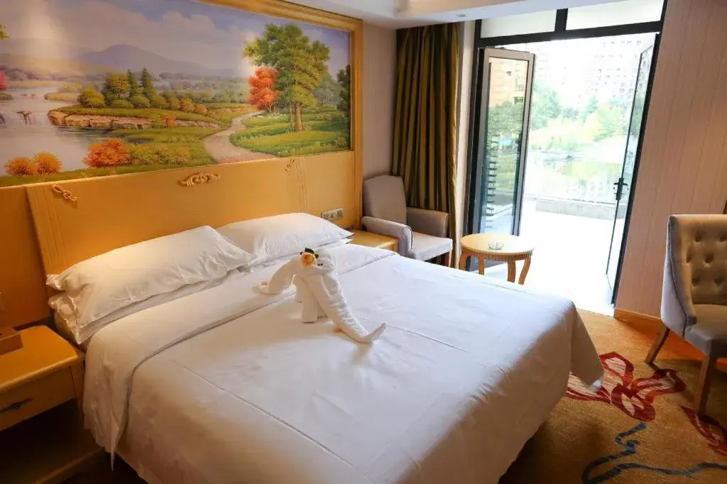 Bed in Vienna Hotel Hangzhou Jiubao Sijiqing Suanli Town Bed in Vienna Hotel Hangzhou Jiubao Sijiqing Suanli Town