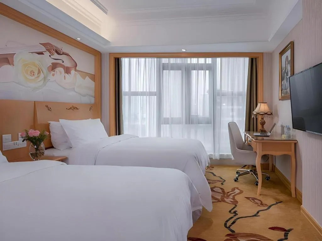 Bed in Vienna Hotel Shenzhen Qinghu Metro Station