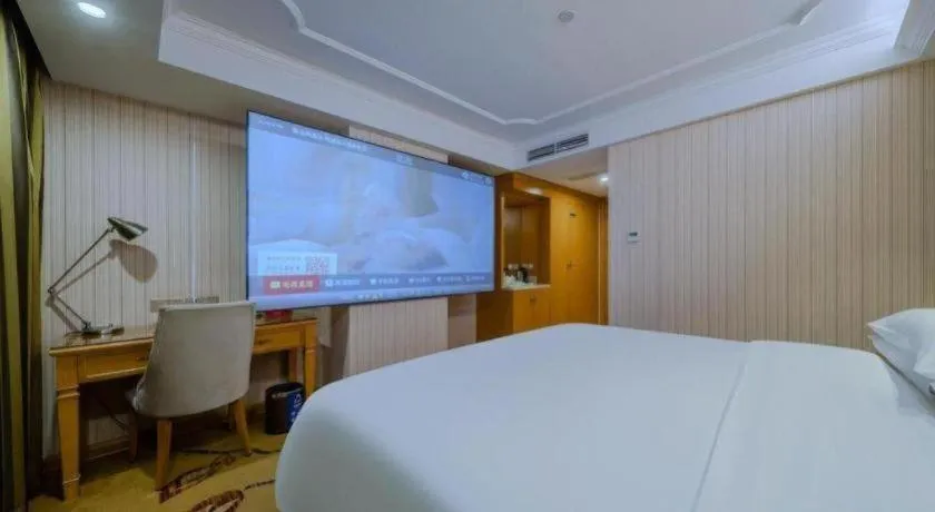 Bed in Vienna Hotel Shenzhen Guanlan Shanshuitianyuan Xintian