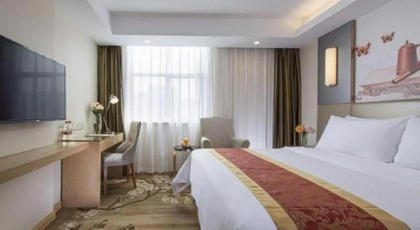 Bed in Vienna Hotel Shenzhen Guanlan Shanshuitianyuan Xintian