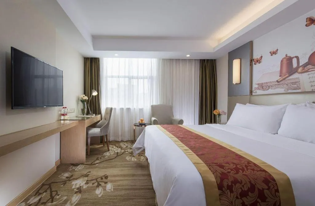 Bed in Vienna Hotel Shenzhen Guanlan Shanshuitianyuan Xintian