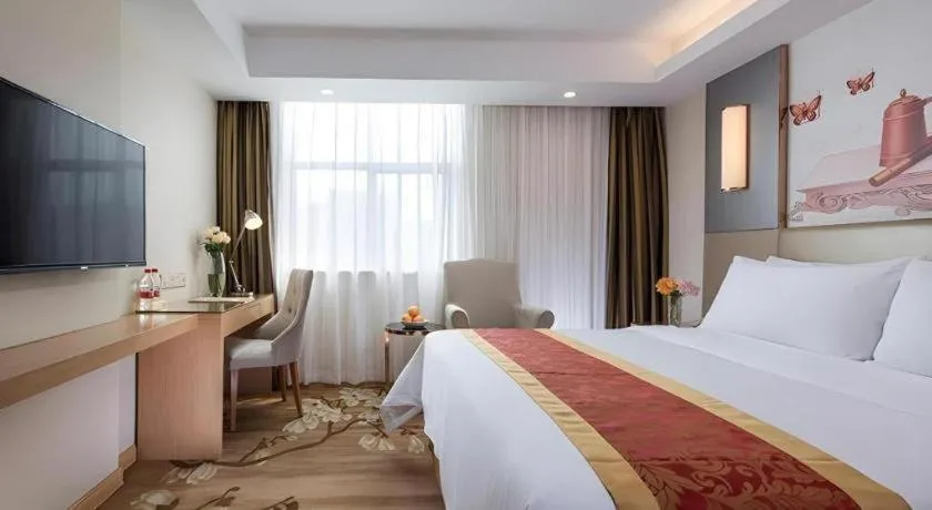 Bed in Vienna Hotel Shenzhen Guanlan Shanshuitianyuan Xintian
