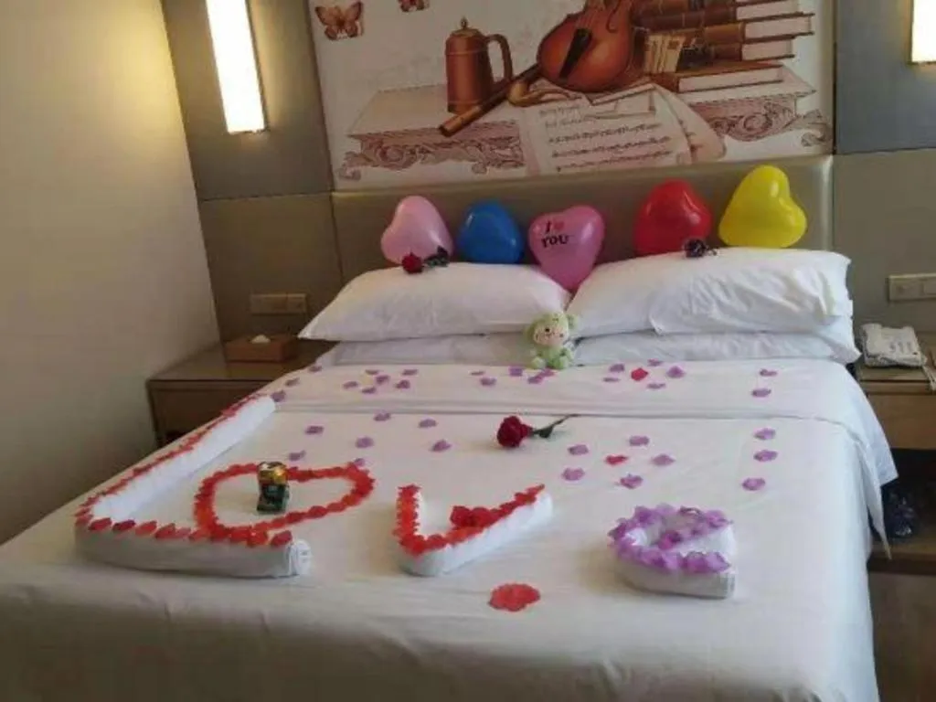 Bed in Vienna Hotel Shenzhen Guanlan Shanshuitianyuan Xintian