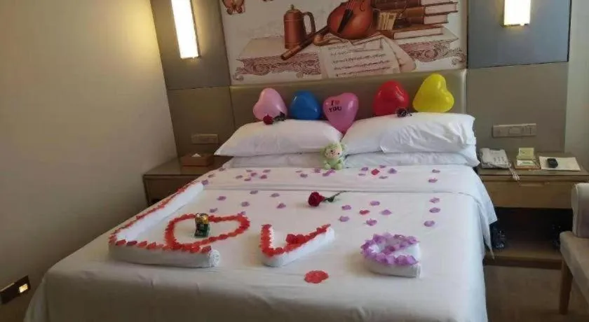 Bed in Vienna Hotel Shenzhen Guanlan Shanshuitianyuan Xintian