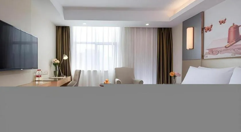 Bed in Vienna Hotel Shenzhen Guanlan Shanshuitianyuan Xintian