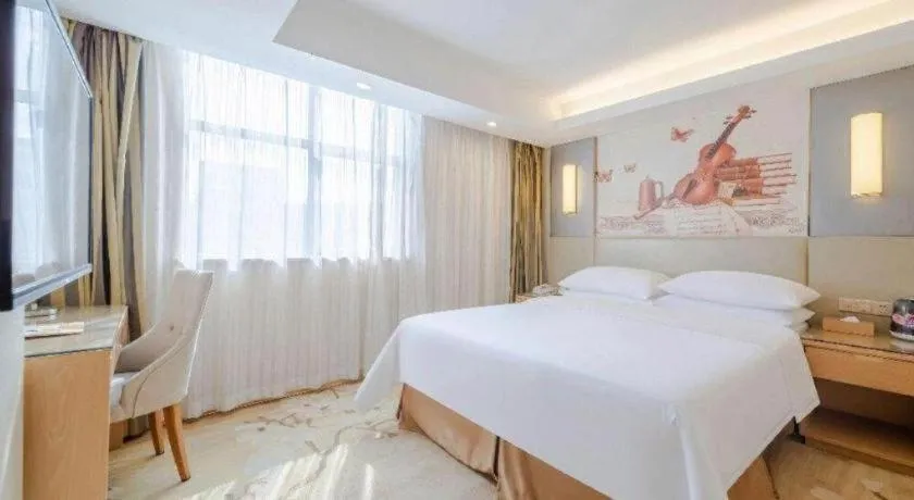 Bed in Vienna Hotel Shenzhen Guanlan Shanshuitianyuan Xintian