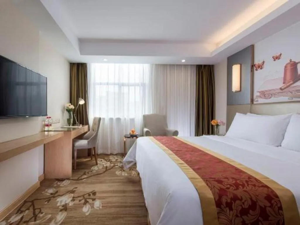 Bed in Vienna Hotel Shenzhen Guanlan Shanshuitianyuan Xintian