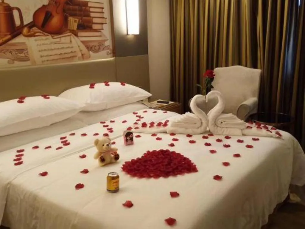 Bed in Vienna Hotel Shenzhen Guanlan Shanshuitianyuan Xintian