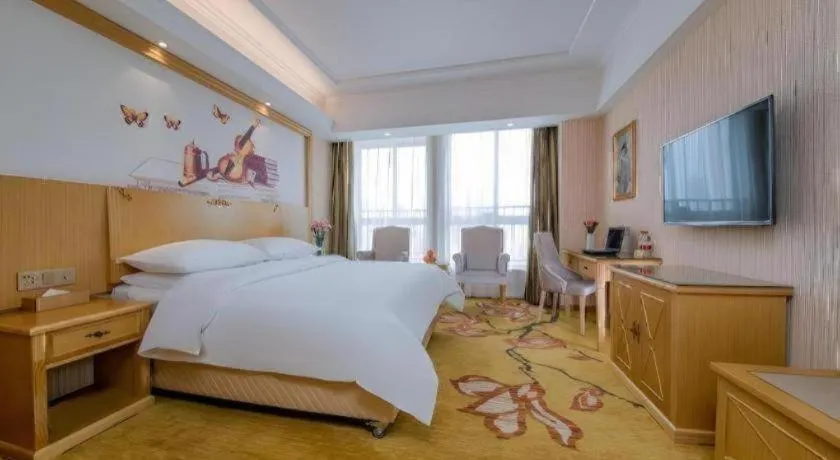 Bed in Vienna Hotel Wuhan Huazhong Normal University Huquan Metro Station