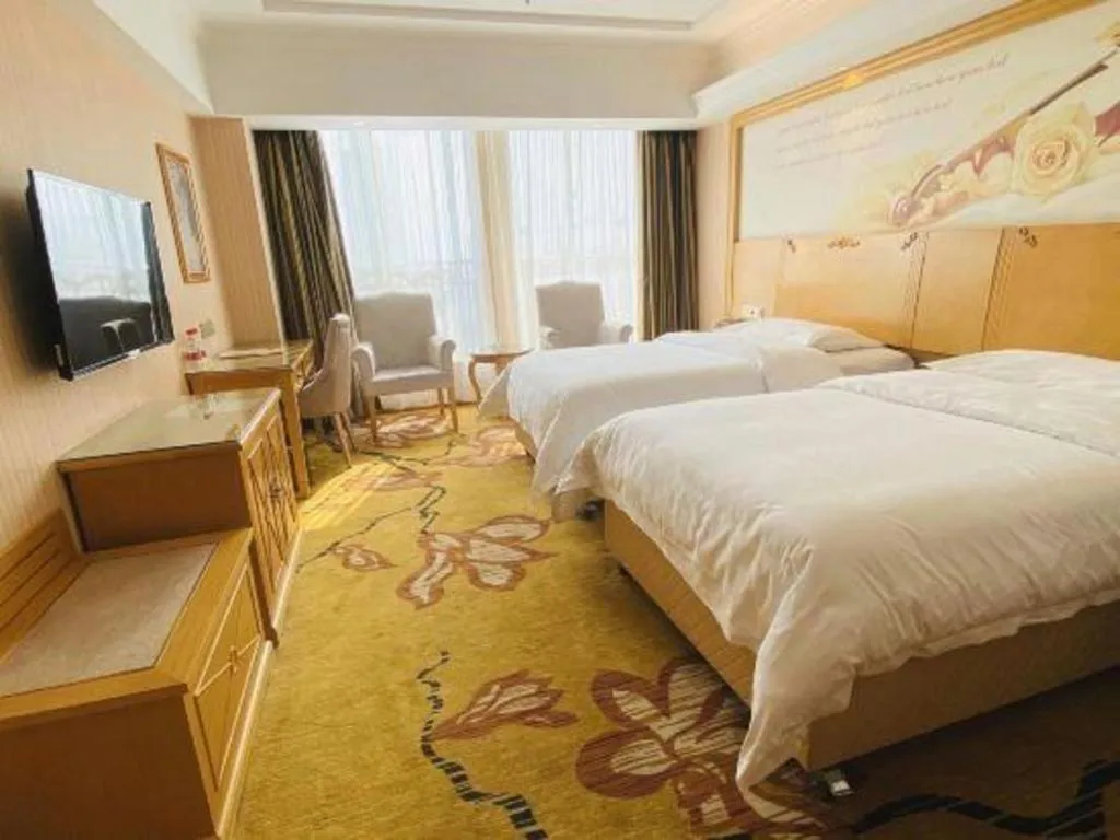 Bed in Vienna Hotel Wuhan Huazhong Normal University Huquan Metro Station