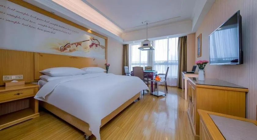 Bed in Vienna Hotel Wuhan Huazhong Normal University Huquan Metro Station