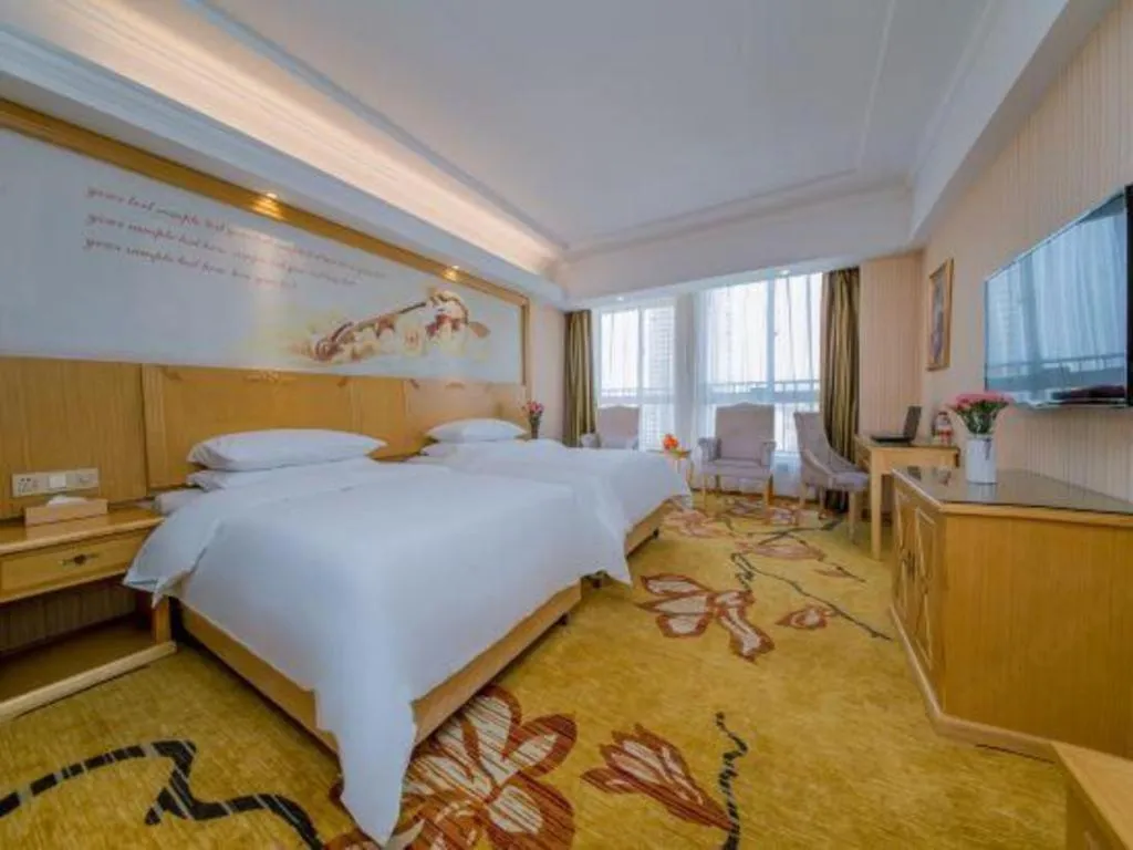 Bed in Vienna Hotel Wuhan Huazhong Normal University Huquan Metro Station