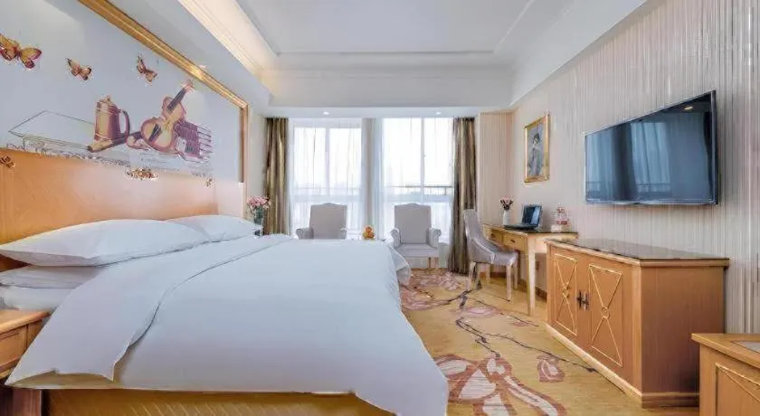 Bed in Vienna Hotel Wuhan Huazhong Normal University Huquan Metro Station