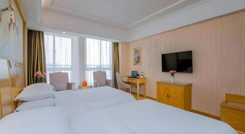Bed in Vienna Hotel Wuhan Huazhong Normal University Huquan Metro Station