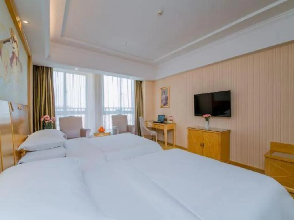 Bed in Vienna Hotel Wuhan Huazhong Normal University Huquan Metro Station