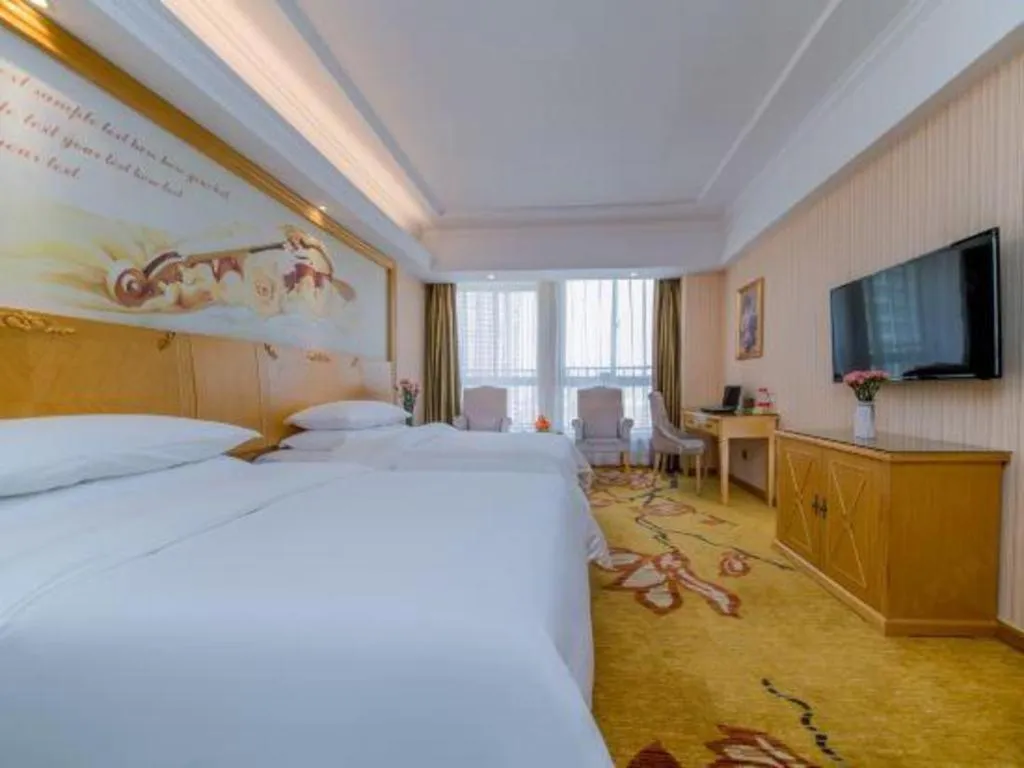 Bed in Vienna Hotel Wuhan Huazhong Normal University Huquan Metro Station